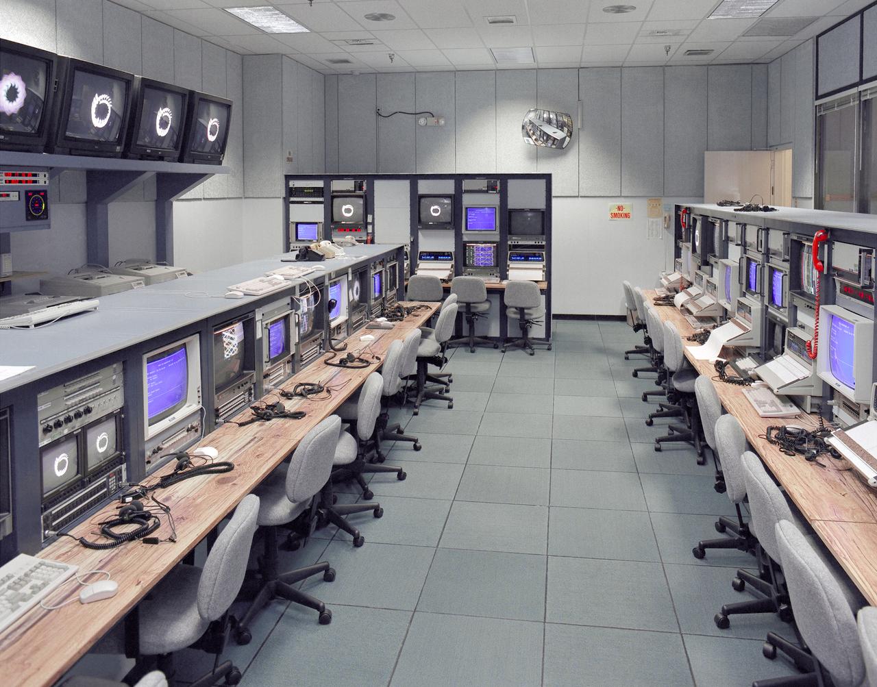 Mission control Blue Room, seen here, in building 4800 at NASA's Dryden Flight Research Center, is part of the Western Aeronautical Test Range (WATR). All aspects of a research mission are monitored from one of two of these control rooms at Dryden.  The WATR consists of a highly automated complex of computer controlled tracking, telemetry, and communications systems and control room complexes that are capable of supporting any type of mission ranging from system and component testing, to sub-scale and full-scale flight tests of new aircraft and reentry systems. Designated areas are assigned for spin/dive tests, corridors are provided for low, medium, and high-altitude supersonic flight, and special STOL/VSTOL facilities are available at Ames Moffett and Crows Landing. Special use airspace, available at Edwards, covers approximately twelve thousand square miles of mostly desert area. The southern boundary lies to the south of Rogers Dry Lake, the western boundary lies midway between Mojave and Bakersfield, the northern boundary passes just south of Bishop, and the eastern boundary follows about 25 miles west of the Nevada border except in the northern areas where it crosses into Nevada.