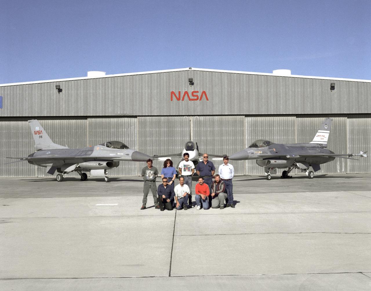 The support crew for the F-16A, the F-16XL no. 1, and the F-16 AFTI are, top row, left to right: Randy Weaver; mechanic, Susan Ligon; mechanic, Bob Garcia; Crew Chief, Rich Kelly; mechanic, Dale Edminister; Avionics Technician. Bottom row, left to right, Art Cope; mechanic, John Huffman; Avionics Technician, Jaime Garcia; Avionics Technician, Don Griffith, Avionics Tech. Co-op student.  The F-16A (NASA 516), the only civil registered F-16 in existence, was transferred to Dryden from Langley, and was primarily used in engine tests and for parts. It was subsequently transfered from Dryden.  The single-seat F-16XL no. 1 (NASA 849) was most recently used in the Cranked-Arrow Wing Aerodynamics Project (CAWAP) to test boundary layer pressures and distribution. Previously it had been used in a program to investigate the characteristics of sonic booms for NASA's High Speed Research Program. Data from the program will be used in the development of a high speed civilian transport. During the series of sonic boom research flights, the F-16XL was used to probe the shock waves being generated by a NASA SR-71 and record their shape and intensity.  The Advanced Fighter Technology Integration (AFTI) F-16 was used to develop and demonstrate technologies to improve navigation and a pilot's ability to find and destroy enemy ground targets day or night, including adverse weather. Earlier research in the joint NASA-Air Force AFTI F-16 program demonstrated voice actuated controls, helmet-mounted sighting and integration of forward-mounted canards with the standard flight control system to achieve uncoupled flight.