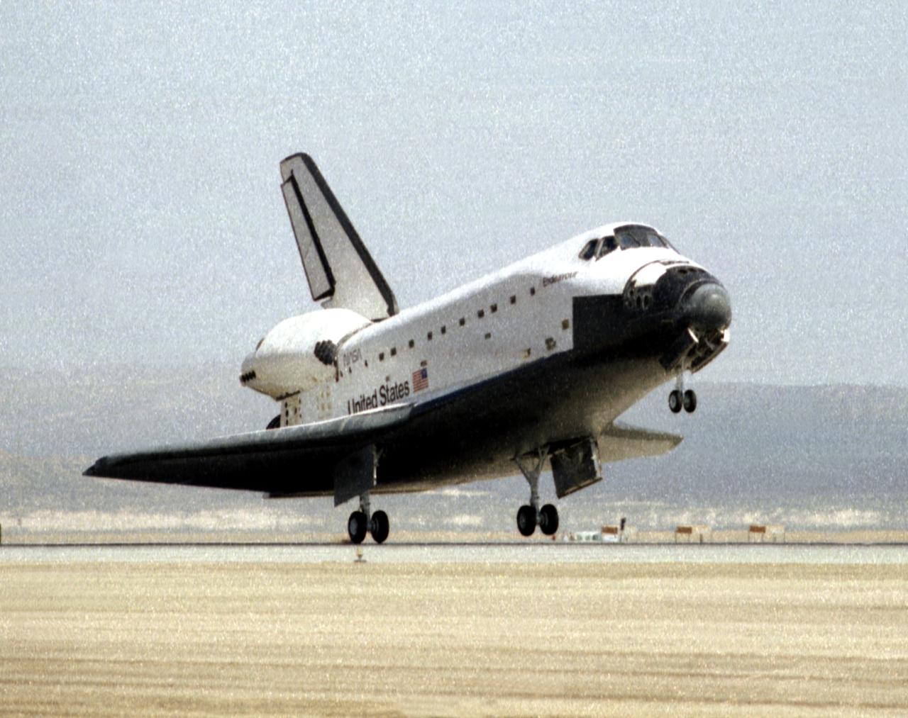The space shuttle Endeavour slips to a smooth landing on runway 22 at Edwards, California, to complete the highly successful record-setting STS-67 mission. The landing was at 1:46 p.m. (PST) 18 March 1995, after waiving off from the Kennedy Space Center, Florida, earlier that morning due to adverse weather. Launched into space at 10:38 a.m. (PST) 1 March 1995, the Endeavour crew conducted NASA's longest shuttle flight to date and carried unique ultraviolet telescopes (ASTRO-2) which captured views of the universe impossible to obtain from the ground. Mission Commander was Steve Oswald making his third flight and the Pilot was Bill Gregory on his first mission. Mission Specialist 1 was John Grunsfeld making his first flight and Specialist 2 was Wendy Lawrence on her first flight. Tamara Jernigan served as Specialist 3 on her third flight and the two payload specialists were Samuel Durrance and Ronald Parise, both on their second flight.