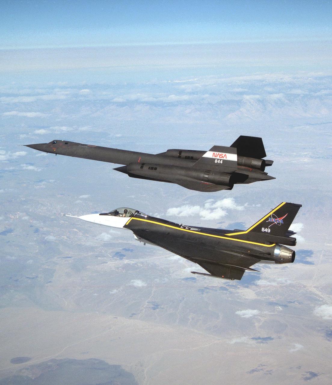 The single-seat F-16XL, NASA 849, joins up with an SR-71A, NASA 844, as crews set up for one of the flights in the recent sonic boom research program conducted by the Dryden Flight Research Center, Edwards, California.  During the missions, the F-16XL probed the shockwaves generated by the SR-71, while at lower altitudes sensors on an F-18 and on a YO-3A, and also on the ground, recorded data from the same shockwave.
