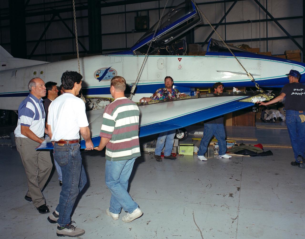 U.S. and German personnel of the X-31 Enhanced Fighter Maneuverability Technology Demonstrator aircraft program removing the right wing of the aircraft, which was ferried from Edwards Air Force Base, California, to Europe on May 22, 1995 aboard an Air Force Reserve C-5 transport.  The X-31, based at the NASA Dryden Flight Research Center was ferried to Europe and flown in the Paris Air Show in June. The wing of the X-31 was removed on May 18, 1995, to allow the aircraft to fit inside the C-5 fuselage. Officials of the X-31 project used Manching, Germany, as a staging base to prepare the aircraft for the flight demonstration.  At the air show, the X-31 demonstrated the value of using thrust vectoring (directing engine exhaust flow) coupled with advanced flight control systems to provide controlled flight at very high angles of attack. The aircraft arrived back at Edwards in a Air Force Reserve C-5 on June 25, 1995 and off loaded at Dryden June 27.  The X-31 aircraft was developed jointly by Rockwell International's North American Aircraft Division (now part of Boeing) and Daimler-Benz Aerospace (formerly Messerschmitt-Bolkow-Blohm), under sponsorship by the U.S. Department of Defense and the German Federal Ministry of Defense.