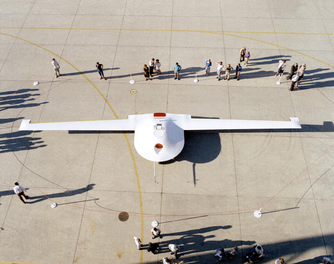 The Lockheed Martin/Boeing Tier III- (minus) unpiloted aerial vehicle is inspected by NASA personnel September 14, 1995, following its arrival at the Dryden Flight Research Center, Edwards, California.