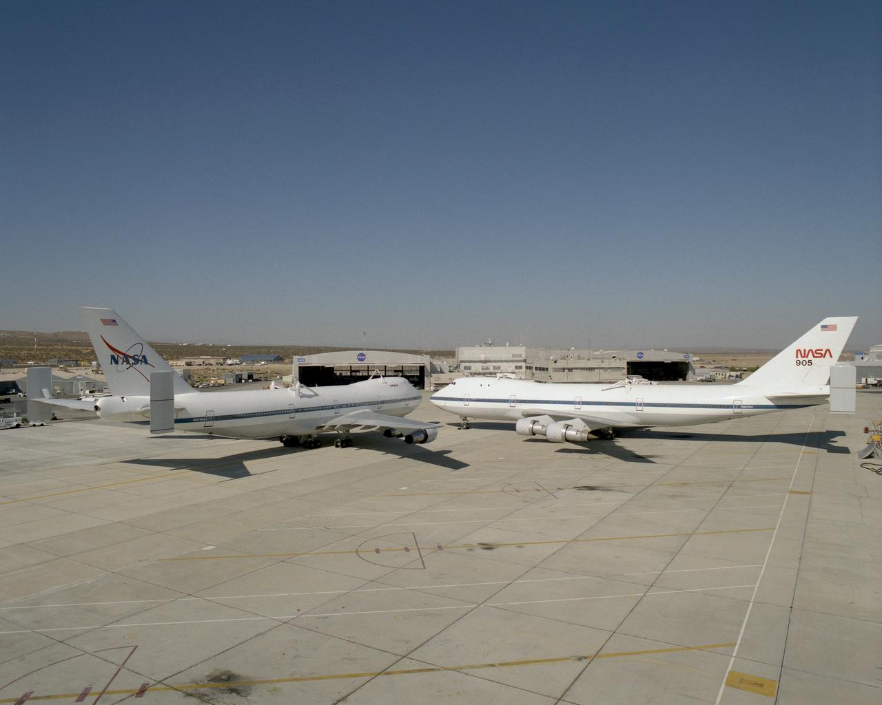 NASA's two modified Boeing 747 Shuttle Carrier Aircraft #911 (left) and #905 (right) were nose-to-nose on the ramp at NASA Dryden in this 1995 photo.