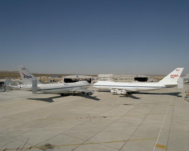 NASA image: NASA's two modified Boeing 747 Shuttle Carrier Aircraft #911 (left) and #905 (right) were nose-to-nose on the ramp at NASA Dryden in this 1995 photo
