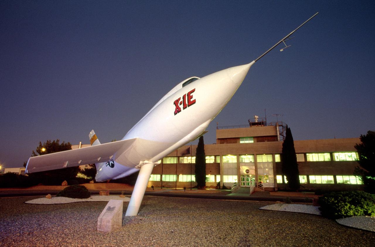 The X-1E guards NASA Dryden Flight Research Center's main building.