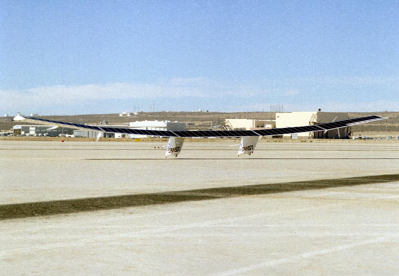 The Pathfinder research aircraft's solar cell arrays are prominently displayed as it touches down on the bed of Rogers Dry Lake at the Dryden Flight Research Center, Edwards, California, following a test flight. The solar arrays covered more than 75 percent of Pathfinder's upper wing surface, and provided electricity to power its six electric motors, flight controls, communications links and a host of scientific sensors.
