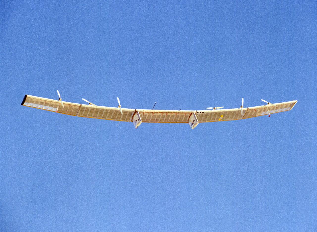 The Pathfinder solar-powered research aircraft is silhouetted against a clear blue sky as it soars aloft during a checkout flight from the Dryden Flight Research Center, Edwards, California, November, 1996.