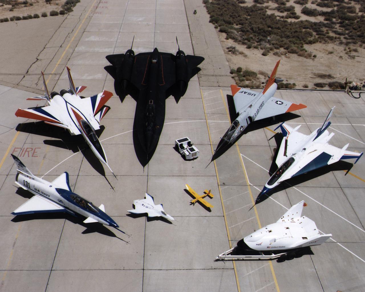 A collection of NASA's research aircraft on the ramp at the Dryden Flight Research Center in July 1997: X-31, F-15 ACTIVE, SR-71, F-106, F-16XL Ship #2, X-38, Radio Controlled Mothership and X-36.