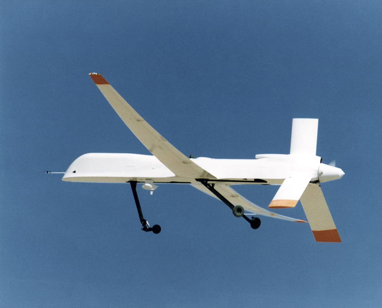 Altus I aircraft in flight, retracting landing gear after takeoff