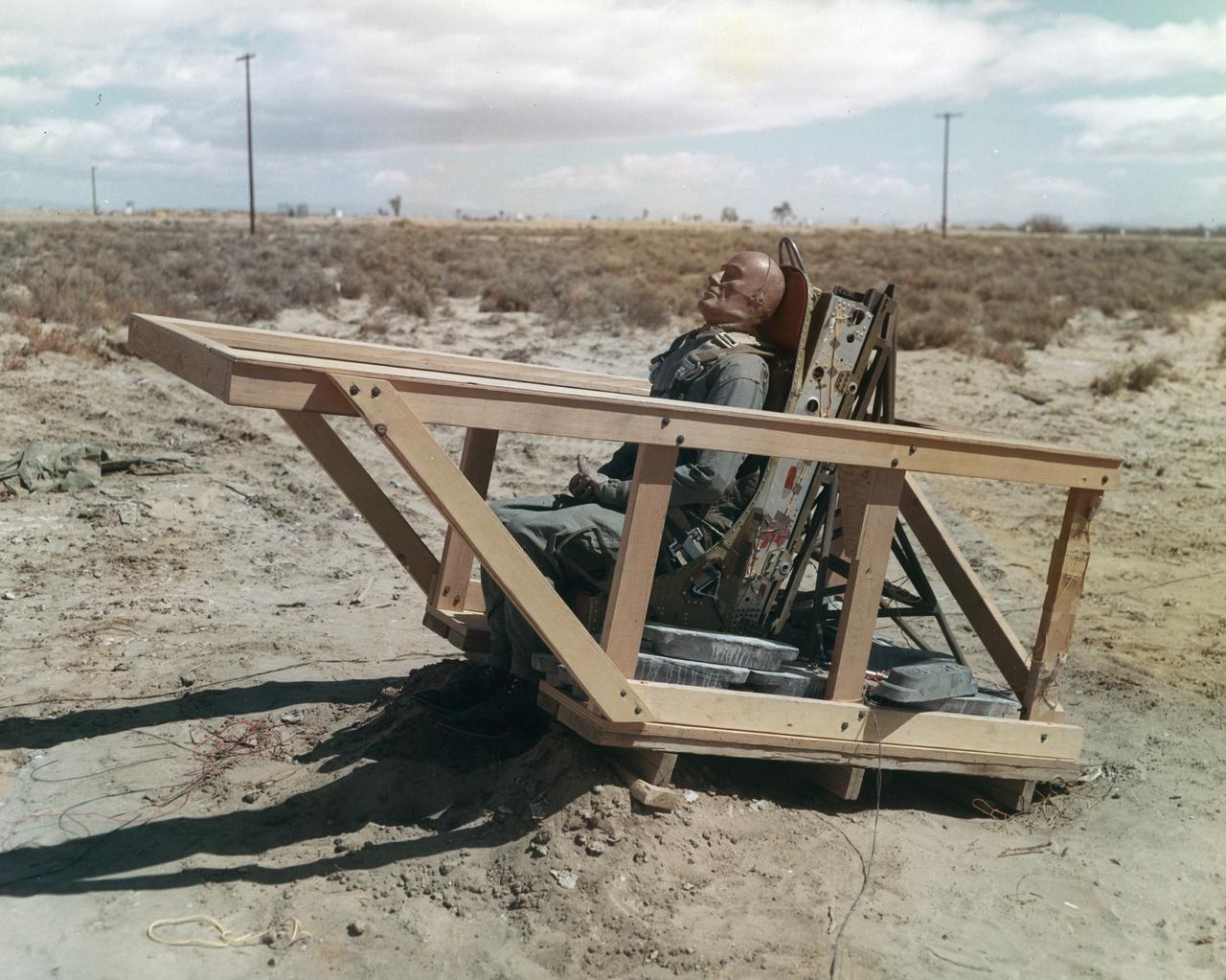 The M2-F1 was fitted with an ejection seat before the airtow flights began. The project selected the seat used in the T-37 as modified by the Weber Company to use a rocket rather than a ballistic charge for ejection. To test the ejection seat, the Flight Research Center's Dick Klein constructed a plywood mockup of the M2-F1's top deck and canopy. On the first firings, the test was unsuccessful, but on the final test the dummy in the seat landed safely. The M2-F1 ejection seat was later used in the two Lunar Landing Research Vehicles and the three Lunar Landing Training Vehicles. Three of them crashed, but in each case the pilot ejected from the vehicle successfully.