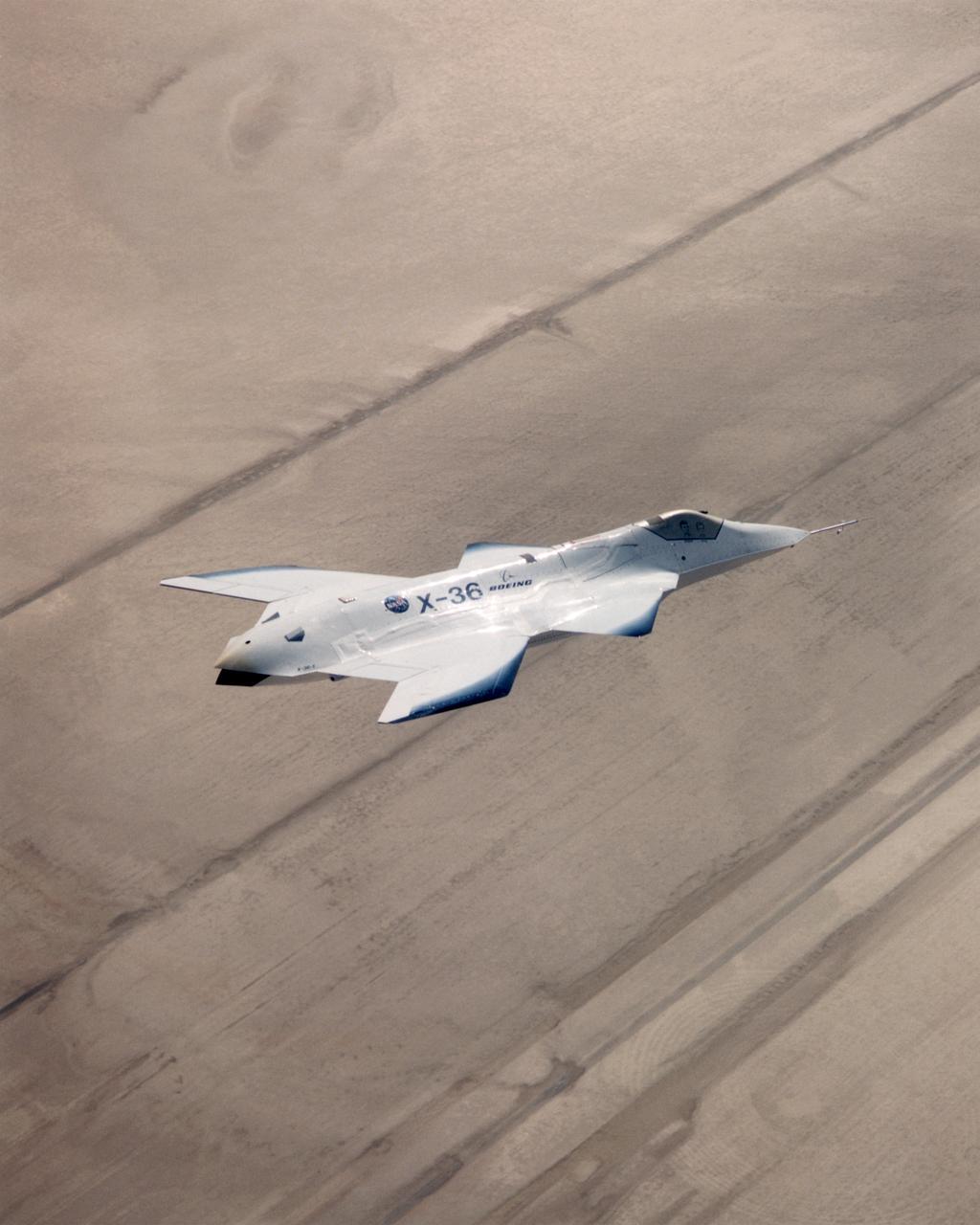 The X-36 technology demonstrator shows off its distinctive shape as the remotely piloted aircraft flies a research mission over the Southern California desert on October 30, 1997.
