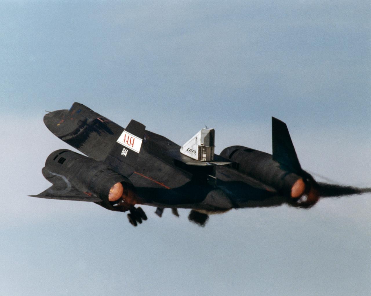 This photograph shows the LASRE pod on the upper rear fuselage of an SR-71 aircraft during take-off of the first flight to experience an in-flight cold flow test. The flight occurred on 4 March 1998.