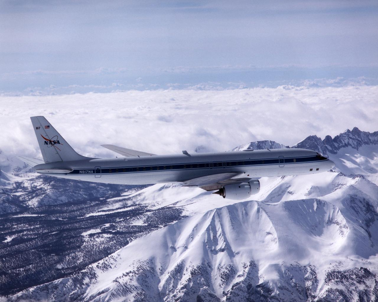 NASA's DC-8 Airborne Laboratory during a flight over the snow-covered Sierra Nevada Mountains. Over the past several years the DC-8 has conducted research missions in such diverse places as the Pacific in spring and Sweden in winter.
