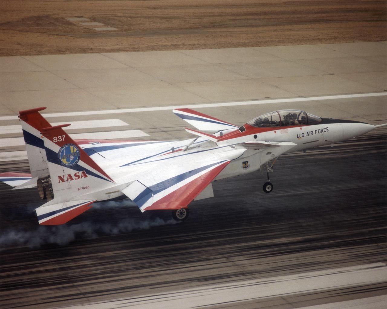 The F-15 ACTIVE touches down on the Edwards runway following its April 14, 1998 flight. The nose is high while the canards have their rear edge raised. the aircraft's speed brake, located on the top of the aircraft behind the canopy, is also raised. 