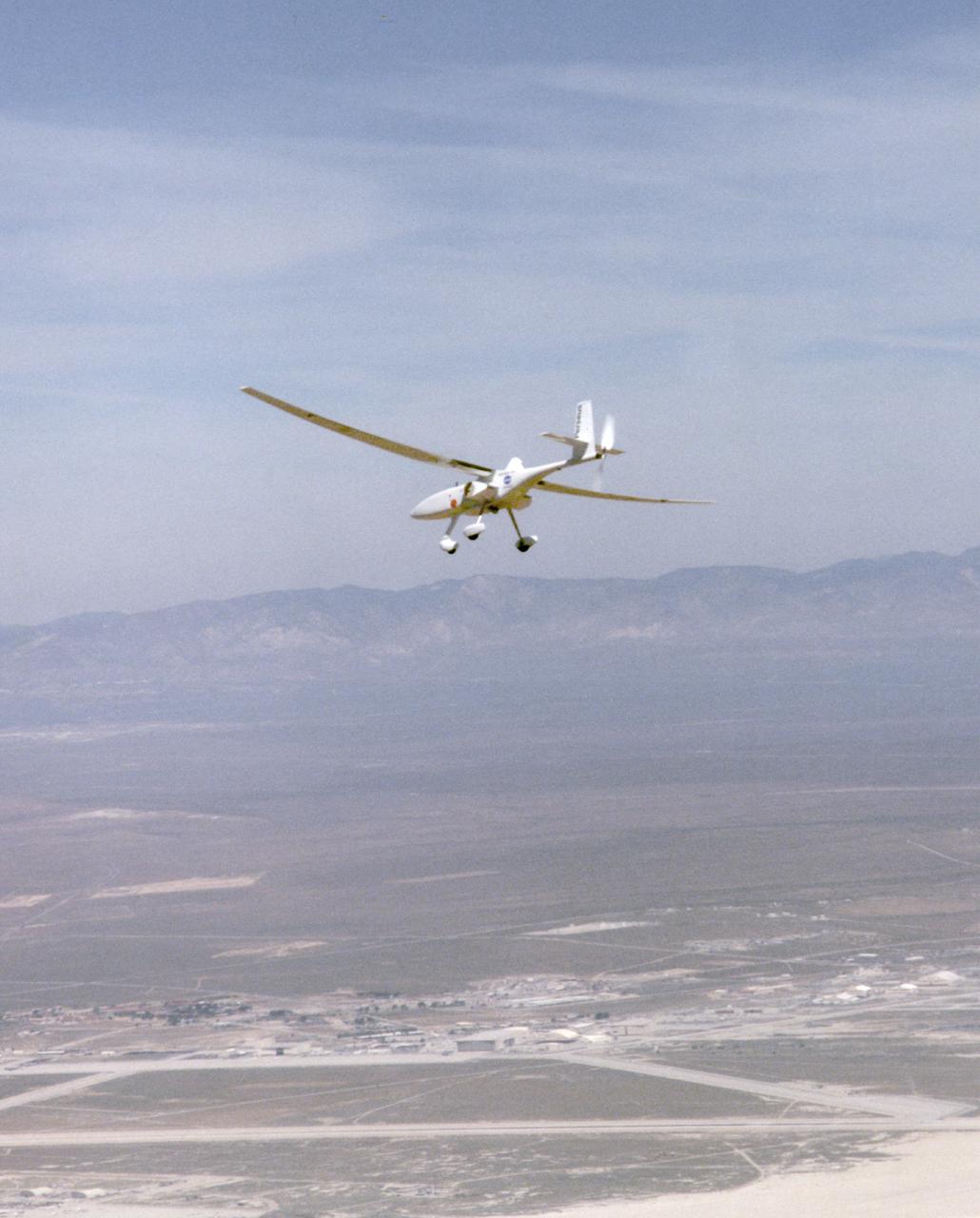 A long, slender wing and a pusher propeller at the rear characterize the Perseus B remotely-piloted research aircraft, seen here during a test flight in April1998.