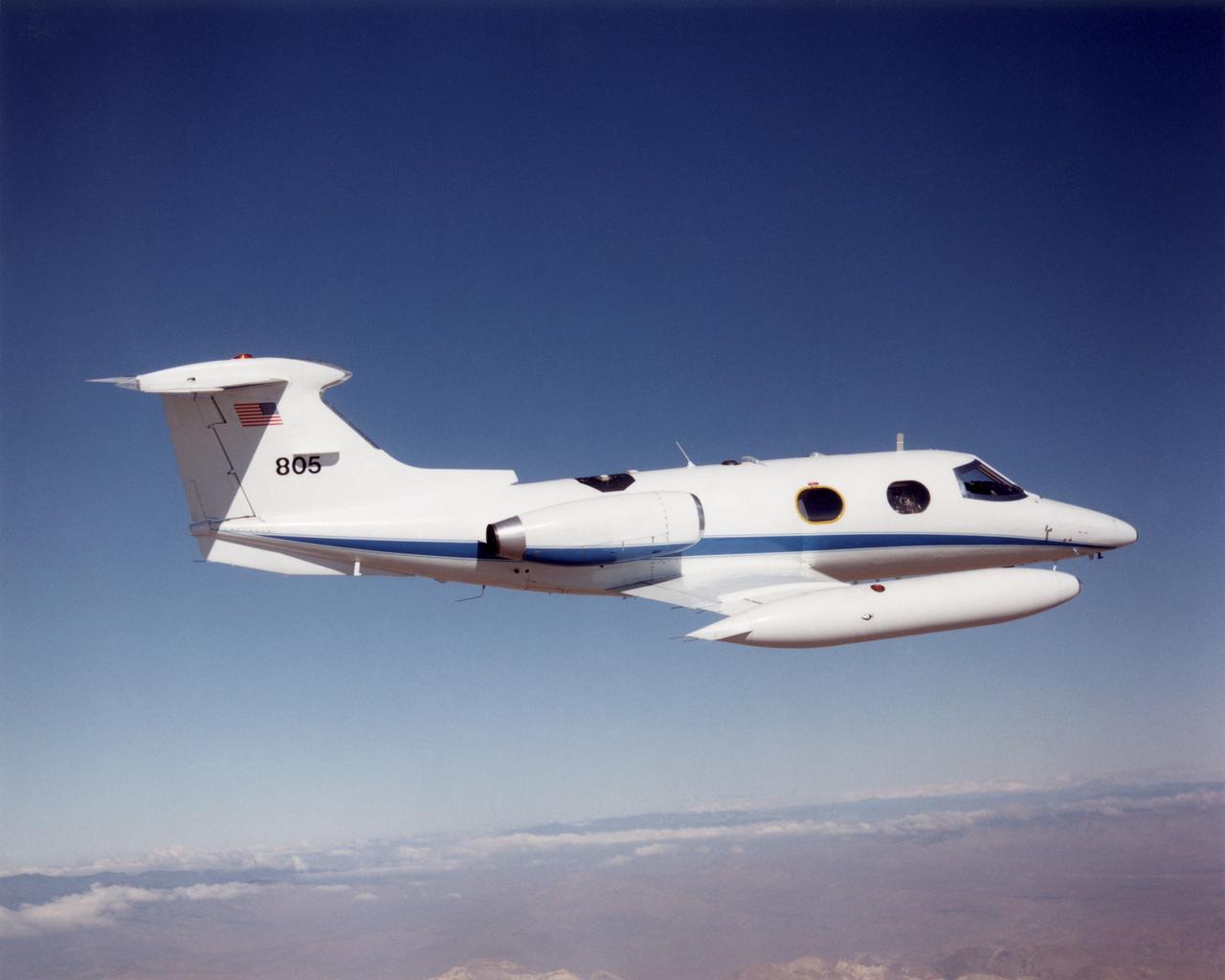 NASA Dryden Flight Research Center's Lear 24, tail number 805, in flight.