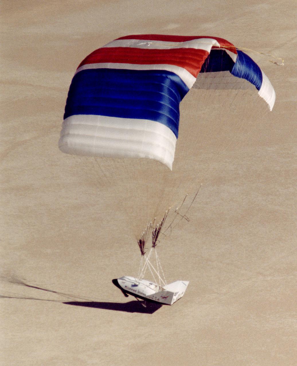 The X-38, a research vehicle built to help develop technology for an emergency Crew Return Vehicle (CRV), flares for its lakebed landing at the end of a March 1999 test flight at the Dryden Flight Research Center, Edwards, California.