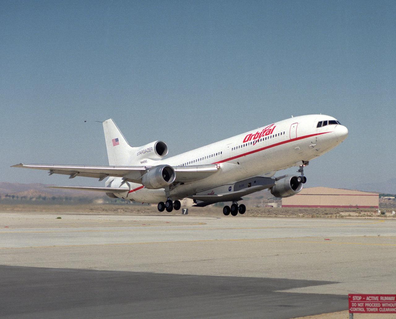 X-34 mated to modified L-1011 during takeoff on first captive carry flight