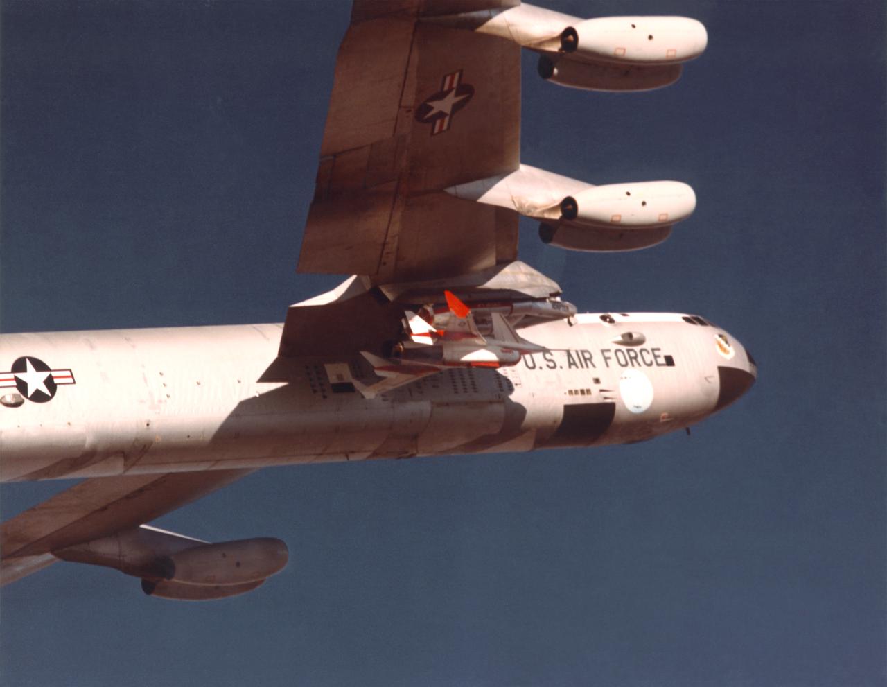 The Highly Maneuverable Aircraft Technology (HiMAT) research vehicle is shown here mated to a wing pylon on NASA’s B-52 mothership aircraft. The HiMAT was a technology demonstrator to test structures and configurations for advanced fighter concepts. Over the course of more than 40 years, the B-52 proved a valuable workhorse for NASA’s Dryden Flight Research Center (under various names), launching a wide variety of vehicles and conducting numerous other research flights.