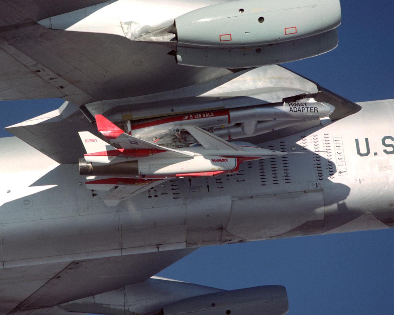 A close-up view of the Highly Maneuverable Aircraft Technology (HiMAT) research vehicle attached to a wing pylon on NASA’s B-52 mothership during a 1980 test flight. The HiMAT used sharply swept-back wings and a canard configuration to test possible technology for advanced fighters.