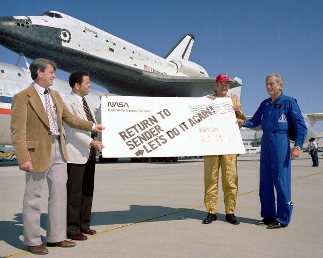 NASA image: Melvin Burke, Ike Gillam, Fitz Fulton, and Deke Slayton give the Space Shuttle Columbia a humorous sendoff before it's ferry flight back to KSC in Florida