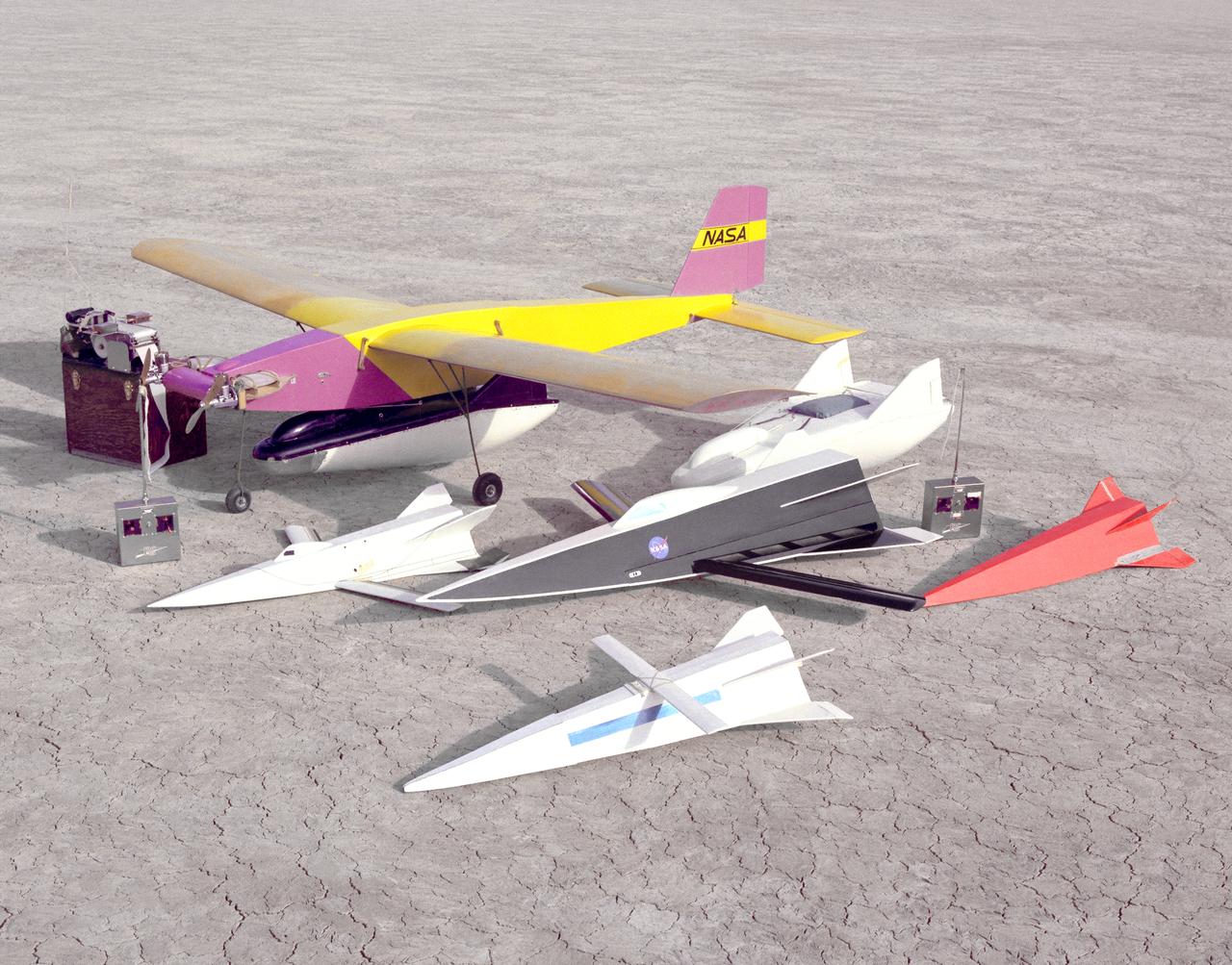 Flight Research Center and Dryden Flight Research Center engineer R. Dale Reed has long used free-flight models to test new concepts. This photo from 1963 shows two different models of the M2-F2 (one under the Mothership) and four Hyper III shapes.