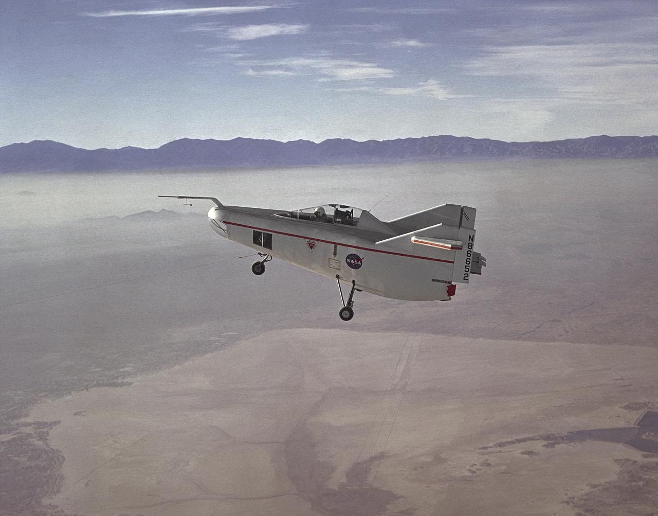 The M2-F1 Lifting Body is seen here under tow, high above Rogers Dry Lake near the Flight Research Center (later redesignated the Dryden Flight Research Center), Edwards, California. R. Dale Reed effectively advocated the project with the support of NASA research pilot Milt Thompson. Together, they gained the support of Flight Research Center Director Paul Bikle. After a six-month feasibility study, Bikle gave approval in the fall of 1962 for the M2-F1 to be built.