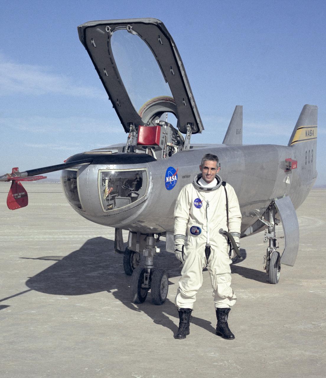 NASA research pilot John A. Manke is seen here in front of the M2-F3 Lifting Body. Manke was hired by NASA on May 25, 1962, as a flight research engineer. He was later assigned to the pilot's office and flew various support aircraft including the F-104, F5D, F-111 and C-47. After leaving the Marine Corps in 1960, Manke worked for Honeywell Corporation as a test engineer for two years before coming to NASA. He was project pilot on the X-24B and also flew the HL-10, M2-F3, and X-24A lifting bodies. John made the first supersonic flight of a lifting body and the first landing of a lifting body on a hard surface runway. Manke served as Director of the Flight Operations and Support Directorate at the Dryden Flight Research Center prior to its integration with Ames Research Center in October 1981. After this date John was named to head the joint Ames-Dryden Directorate of Flight Operations. He also served as site manager of the NASA Ames-Dryden Flight Research Facility.  John is a member of the Society of Experimental Test Pilots. He retired on April 27, 1984.