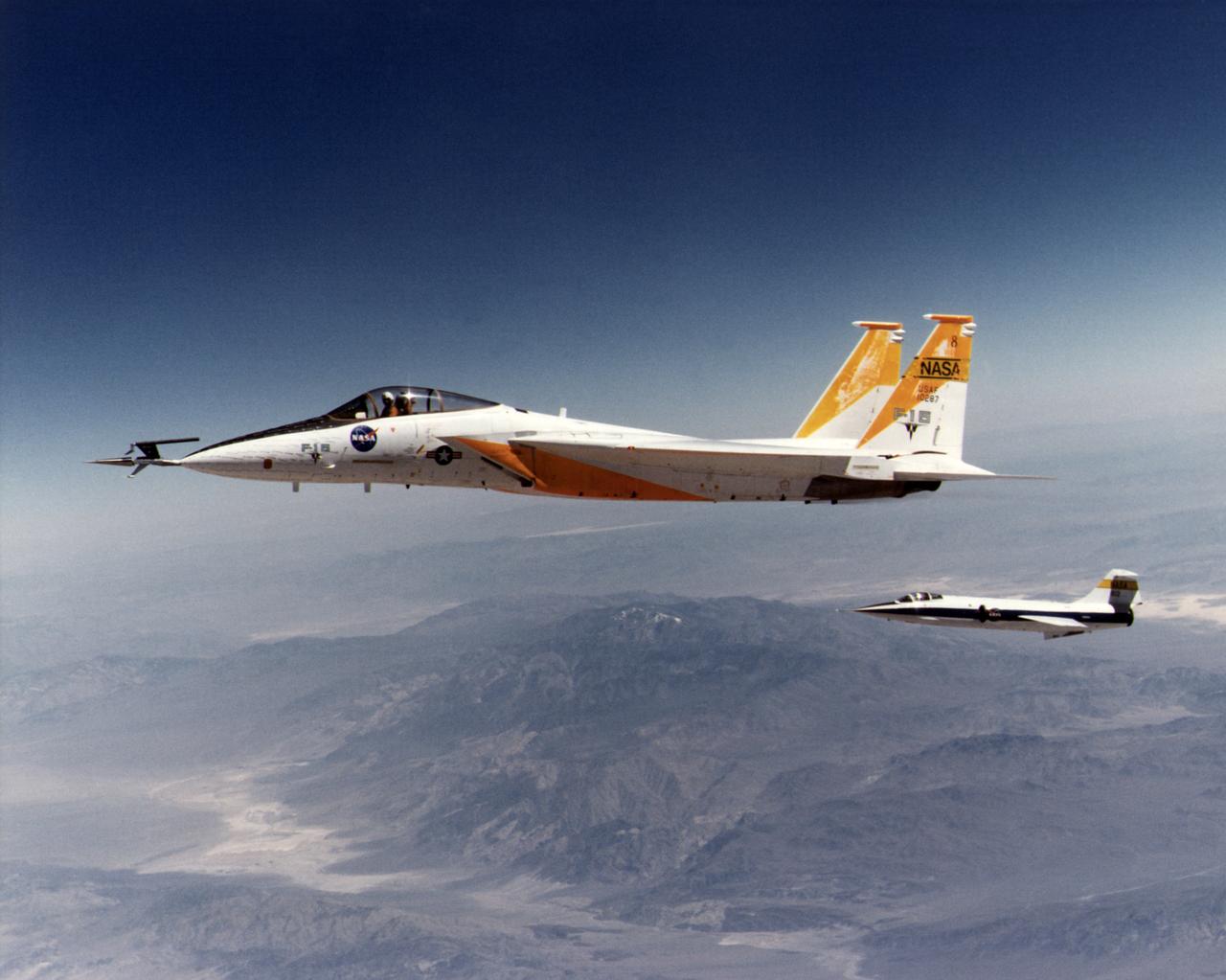An in-flight photo of the NASA F-15A used to carry a 10 degree cone to collect aerodynamic data to calibrate the data from wind tunnels. The flight was made on May 17, 1978. Acting as chase for the flight was a NASA F-104 aircraft.