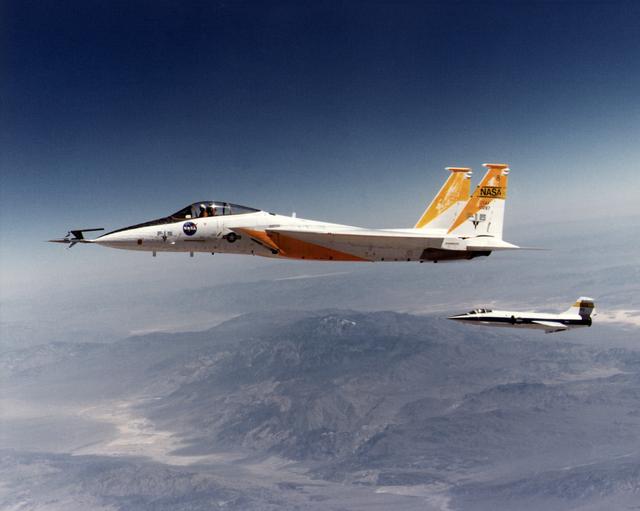 NASA image: F-15A in flight with 10 degree cone experiment and F-104N chase