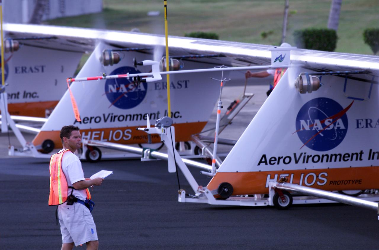 Helios Prototype crew chief Marshall MacCready of AeroVironment, Inc., carefully monitors motor runs during ground checkout of the solar-powered flying wing prior to its first flight from the U.S. Navy's Pacific Missile Range Facility on Kaua'i, Hawaii.