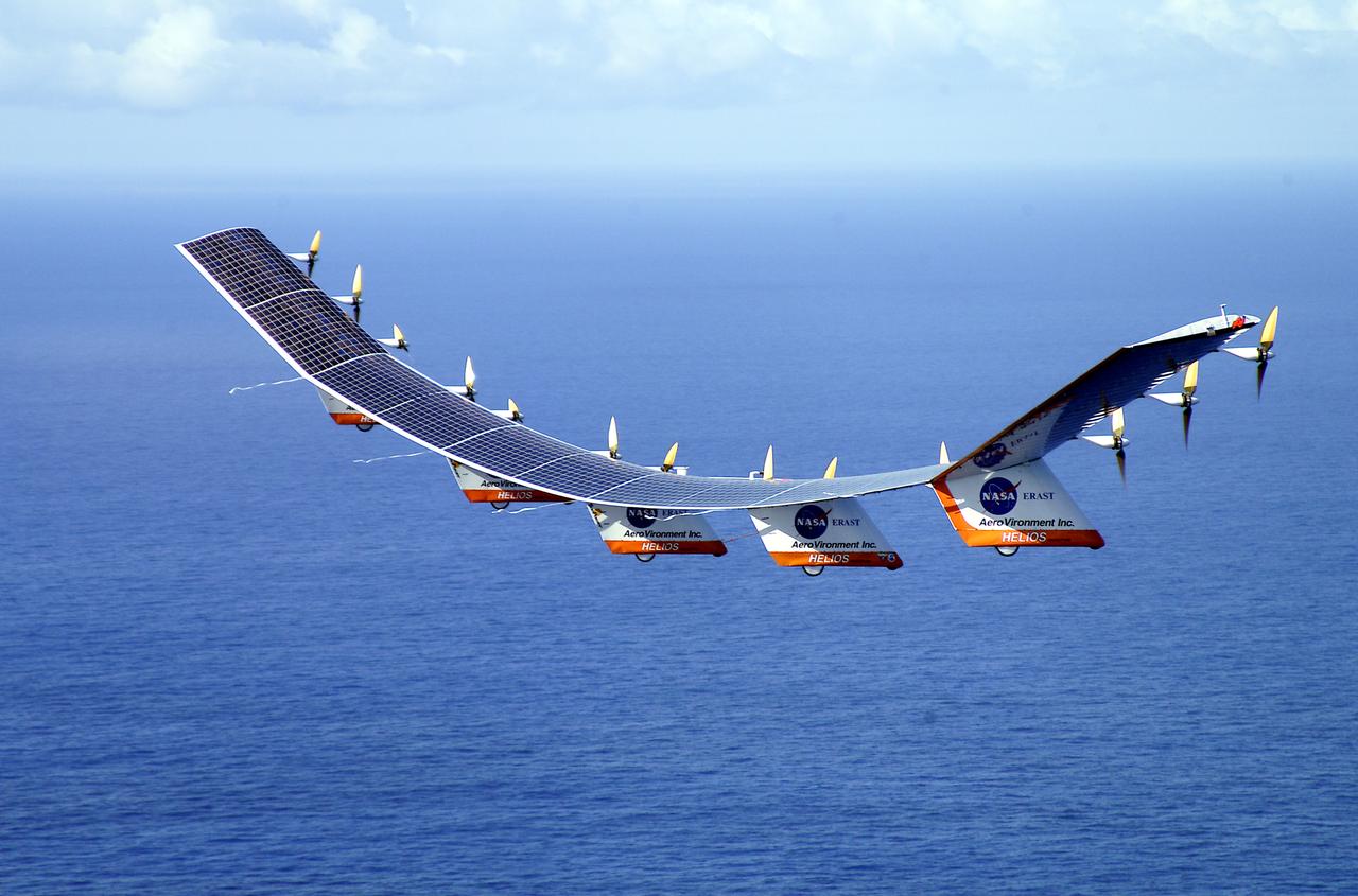 The solar-electric Helios Prototype flying wing is shown over the Pacific Ocean during its first test flight on solar power from the U.S. Navy's Pacific Missile Range Facility on Kauai, Hawaii, July 14, 2001. The 18-hour flight was a functional checkout of the aircraft's systems and performance in preparation for an attempt to reach sustained flight at 100,000 feet altitude later this summer.