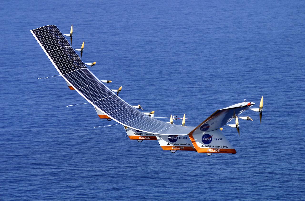 The solar-electric Helios Prototype flying wing is shown over the Pacific Ocean during its first test flight on solar power from the U.S. Navy's Pacific Missile Range Facility on Kauai, Hawaii, July 14, 2001. The 18-hour flight was a functional checkout of the aircraft's systems and performance in preparation for an attempt to reach sustained flight at 100,000 feet altitude later this summer.
