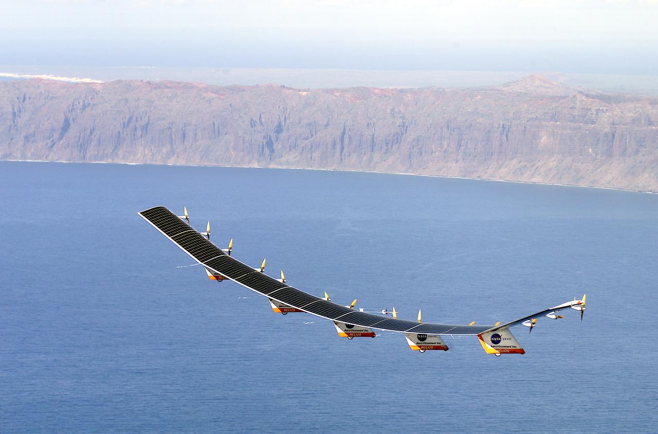 The solar-electric Helios Prototype flying wing is shown near the Hawaiian island of Niihau during its first test flight on solar power from the U.S. Navy's Pacific Missile Range Facility on Kauai, Hawaii, July 14, 2001. The 18-hour flight was a functional checkout of the aircraft's systems and performance in preparation for an attempt to reach sustained flight at 100,000 feet altitude later this summer.