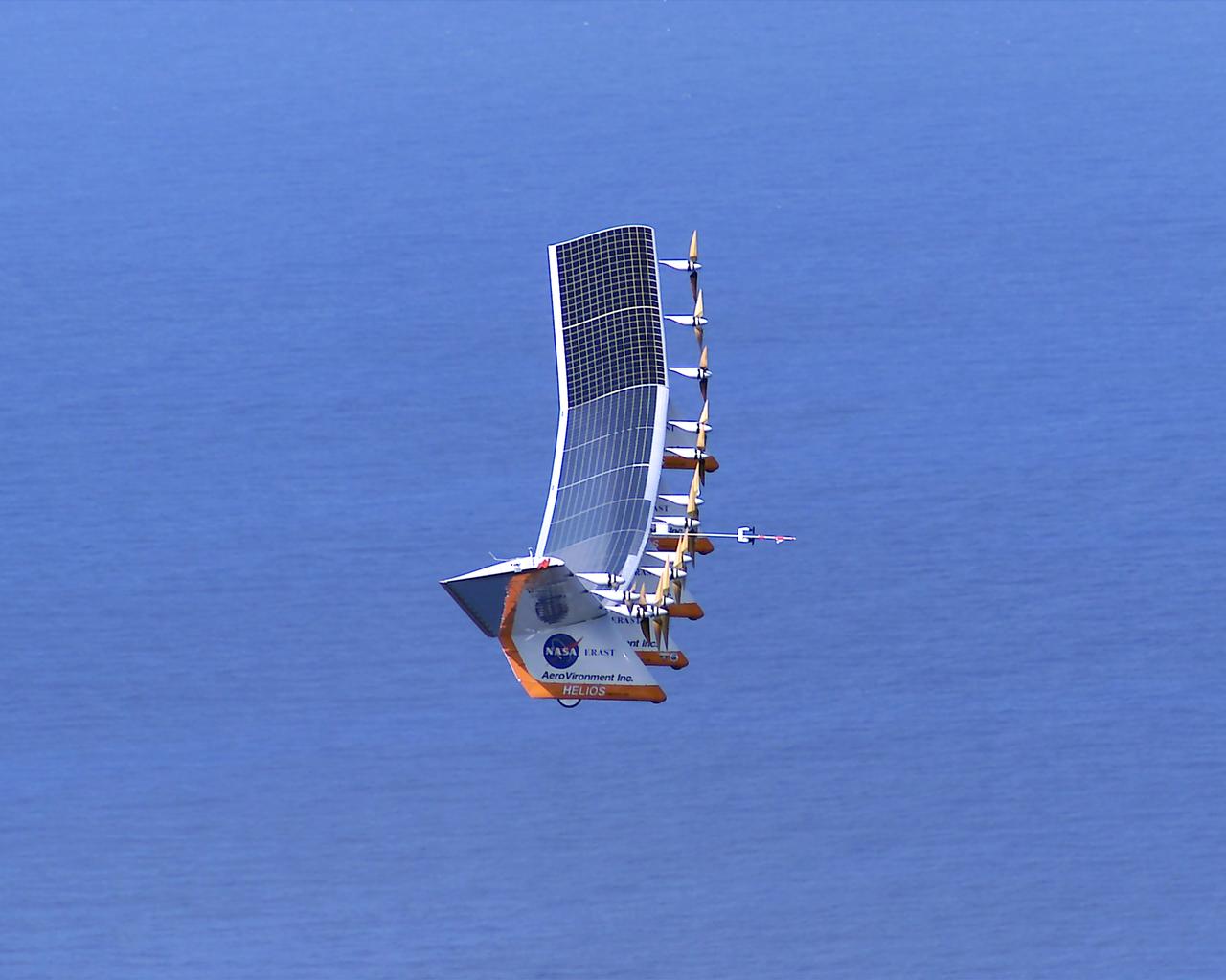 The Helios Prototype aircraft during initial climb-out to the west over the Pacific Ocean.