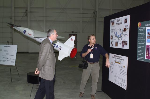 NASA image: NASA Administrator Sean O'Keefe, left, learned about the Mach 10 X-43 research vehicle from manager Joel Sitz during a visit to the NASA Dryden Flight Research Center, Edwards, California, January 31, 2002