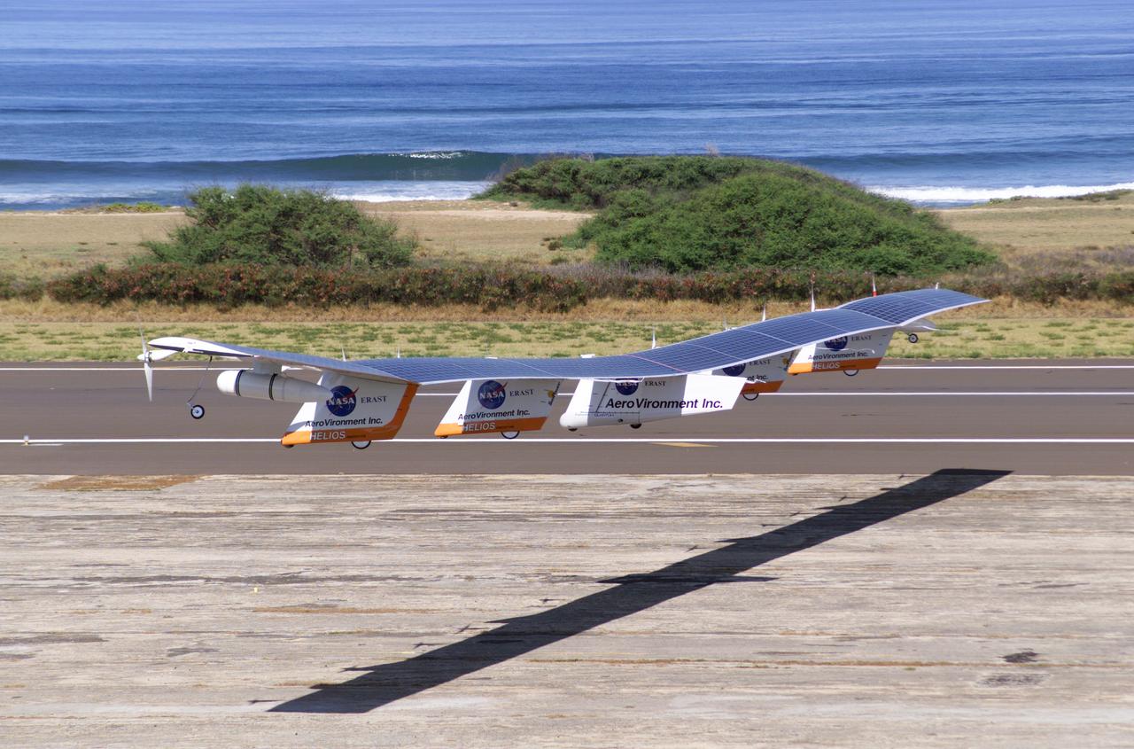 The first flight of a large aircraft to be powered by electric fuel cells began with a takeoff at 8:43 a.m. HST today from the Hawaiian island of Kauai. The Helios Prototype flying wing, built by AeroVironment, Inc., of Monrovia, Calif., as part of NASA's Environmental Research Aircraft and Sensor Technology (ERAST) program, used solar panels to power its 10 electric motors for takeoff and during daylight portions of its planned 20-hour shakedown flight. As sunlight diminishes, Helios will switch to a fuel cell system to continue flight into the night. The takeoff set the stage for a two-day Helios endurance flight in the stratosphere planned for mid-July. The Helios wing, spanning 247 feet and weighing about 2,400 pounds, gave NASA and industry engineers confidence that remotely piloted aircraft would be able to stay aloft for weeks at a time, providing environmental monitoring capabilities and telecommunications relay services.  Helios was an all-electric airplane. In addition to being non-polluting, Helios flew above storms, and used the power of the sun to stay aloft during daylight. Key to the success of this type of aircraft was the ability to fly in darkness, using fuel cells when sunlight cannot furnish energy.  Helios flew over the Navy's Pacific Missile Range Facility where favorable sun exposure and test ranges closed to other air traffic benefited the NASA research effort. In 2003 the aircraft was lost to a crash.