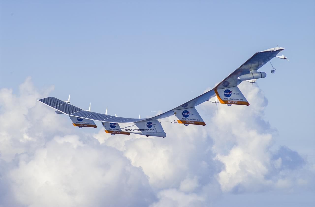 The AeroVironment Helios high-altitude, solar-powered aircraft flies in Kauai, Hawaii. Helios reached 96,300 feet altitude, the record for sustained, level flight for a winged aircraft.
