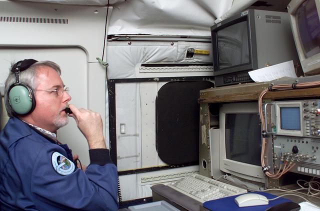 NASA image: JPL Researcher Tim Miller at the primary AirSAR station aboard NASA's DC-8 flying laboratory during the AirSAR 2004 campaign