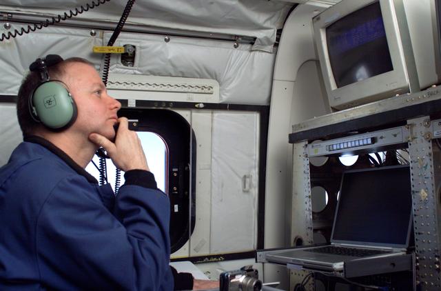 NASA image: JPL Researcher Bruce Chapman at an AirSAR station aboard NASA's DC-8 flying laboratory during the AirSAR 2004 campaign