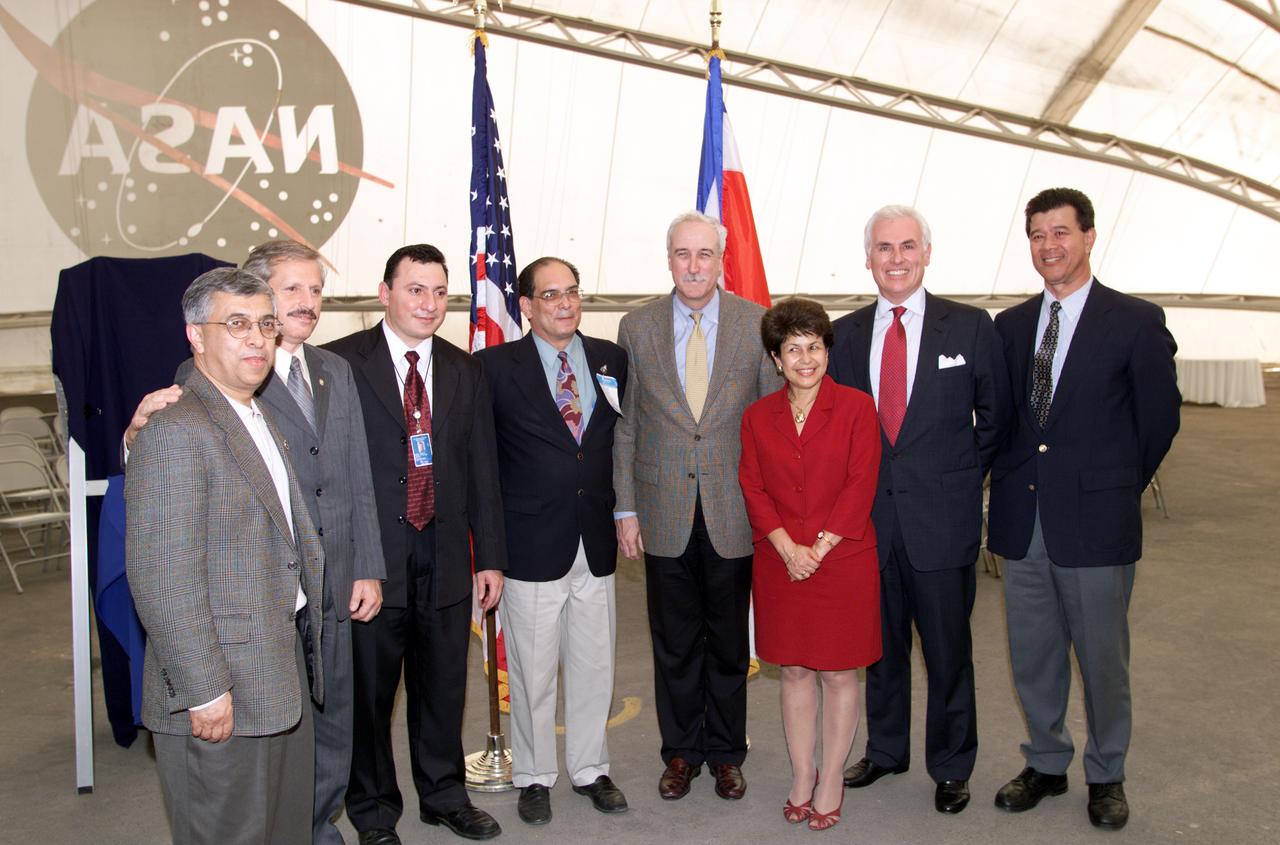 VIP group in hangar during AirSAR 2004 Mesoamerica campaign, L-R: Dr. Gahssem Asrar, NASA Associate Administrator for Earth Science Enterprises; Fernando Gutierrez, Costa Rican Minister of Science and Technology(MICIT); Jorge Andres Diaz, Director of the Costa Rican National Hangar for Airborne Research division of the National Center for High Technology(CENAT); Dr. Pedro Leon, General Director for the Costa Rican National Center for High Technology(CENAT); NASA Administrator Sean O'Keefe; Dr. Sonia Marta Mora, President of the Costa Rican National Rector’s Council(CONARE); Mr. John Danilovich, US Ambassador to Costa Rica; and unknown. AirSAR 2004 Mesoamerica is a three-week expedition by an international team of scientists that will use an all-weather imaging tool, called the Airborne Synthetic Aperture Radar (AirSAR), in a mission ranging from the tropical rain forests of Central America to frigid Antarctica.