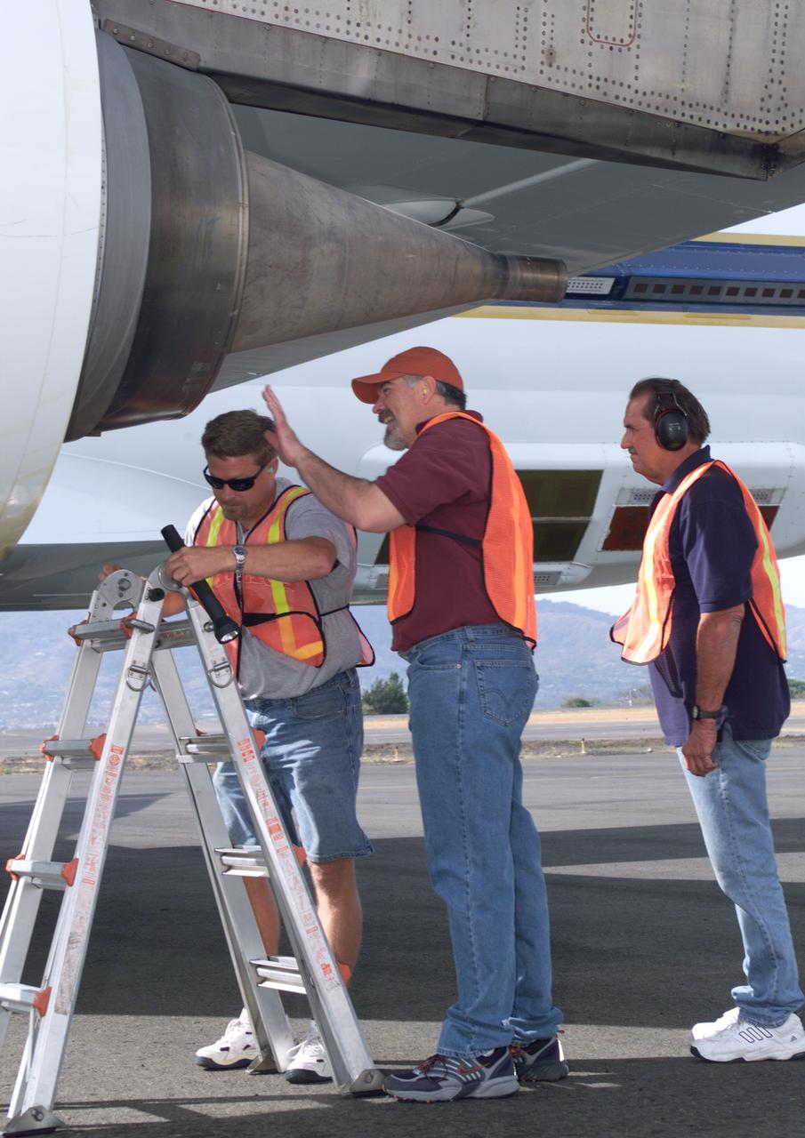 NASA Dryden DC-8 maintenance crew members inspect the aircraft prior to take-off. L-R; Scott Silver, Paul Ristrim and Mike Lakowski. AirSAR 2004 Mesoamerica is a three-week expedition by an international team of scientists that uses an all-weather imaging tool, called the Airborne Synthetic Aperture Radar (AirSAR) which is located onboard NASA's DC-8 airborne laboratory. Scientists from many parts of the world including NASA's Jet Propulsion Laboratory are combining ground research done in several areas in Central America with NASA's AirSAR technology to improve and expand on the quality of research they are able to conduct.  The radar, developed by NASA's Jet Propulsion Laboratory, can penetrate clouds and also collect data at night. Its high-resolution sensors operate at multiple wavelengths and modes, allowing AirSAR to see beneath treetops, through thin sand, and dry snow pack.  AirSAR's 2004 campaign is a collaboration of many U.S. and Central American institutions and scientists, including NASA; the National Science Foundation; the Smithsonian Institution; National Geographic; Conservation International; the Organization of Tropical Studies; the Central American Commission for Environment and Development; and the Inter-American Development Bank.