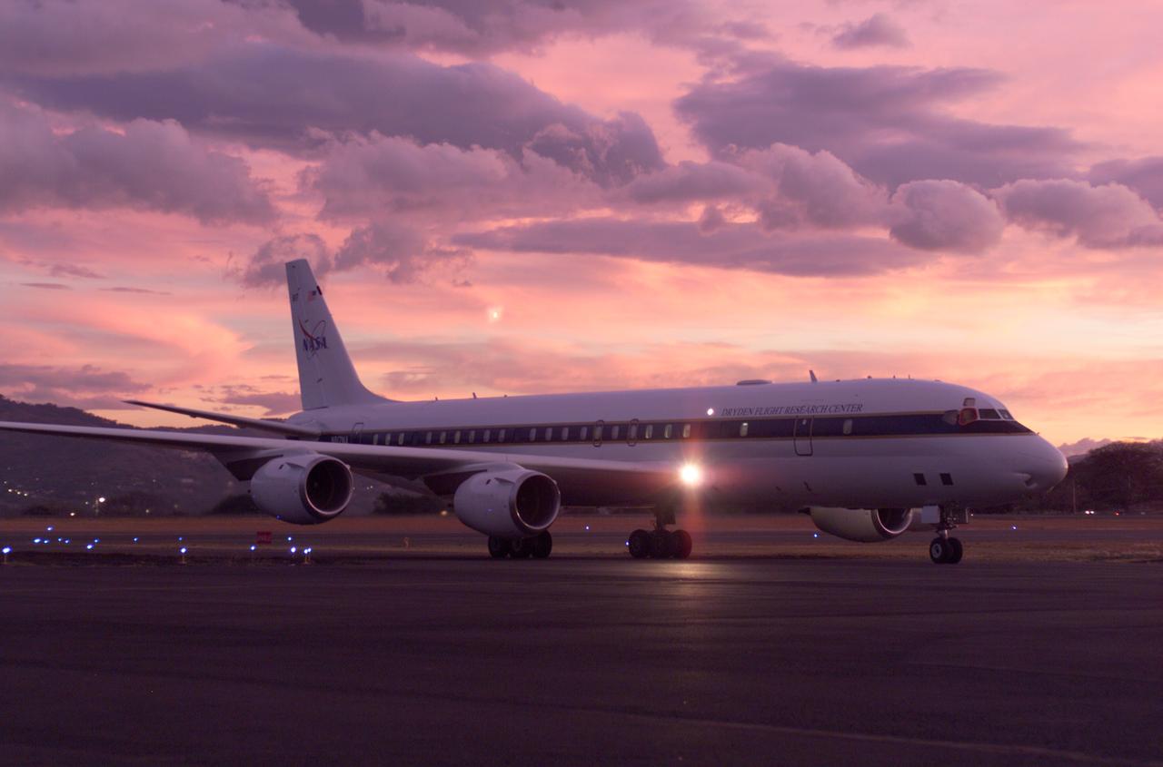 NASA's DC-8 flying laboratory seen at sunset after a flight supporting the AirSAR 2004 Mesoamerica campaign. AirSAR 2004 Mesoamerica is a three-week expedition by an international team of scientists that uses an all-weather imaging tool, called the Airborne Synthetic Aperture Radar (AirSAR) which is located onboard NASA's DC-8 airborne laboratory. Scientists from many parts of the world including NASA's Jet Propulsion Laboratory are combining ground research done in several areas in Central America with NASA's AirSAR technology to improve and expand on the quality of research they are able to conduct.  The radar, developed by NASA's Jet Propulsion Laboratory, can penetrate clouds and also collect data at night. Its high-resolution sensors operate at multiple wavelengths and modes, allowing AirSAR to see beneath treetops, through thin sand, and dry snow pack.  AirSAR's 2004 campaign is a collaboration of many U.S. and Central American institutions and scientists, including NASA; the National Science Foundation; the Smithsonian Institution; National Geographic; Conservation International; the Organization of Tropical Studies; the Central American Commission for Environment and Development; and the Inter-American Development Bank.