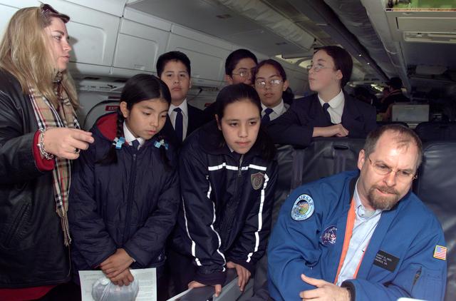 NASA image: School children from Punta Arenas, Chile, talk with Dr. David Imel, an AirSAR scientist from NASA JPL, during AirSAR 2004