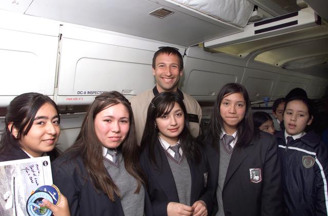 NASA image: NASA Dryden Mission Manager Walter Klein poses with school children that visited the DC-8 during AirSAR 2004 in Punta Arenas, Chile