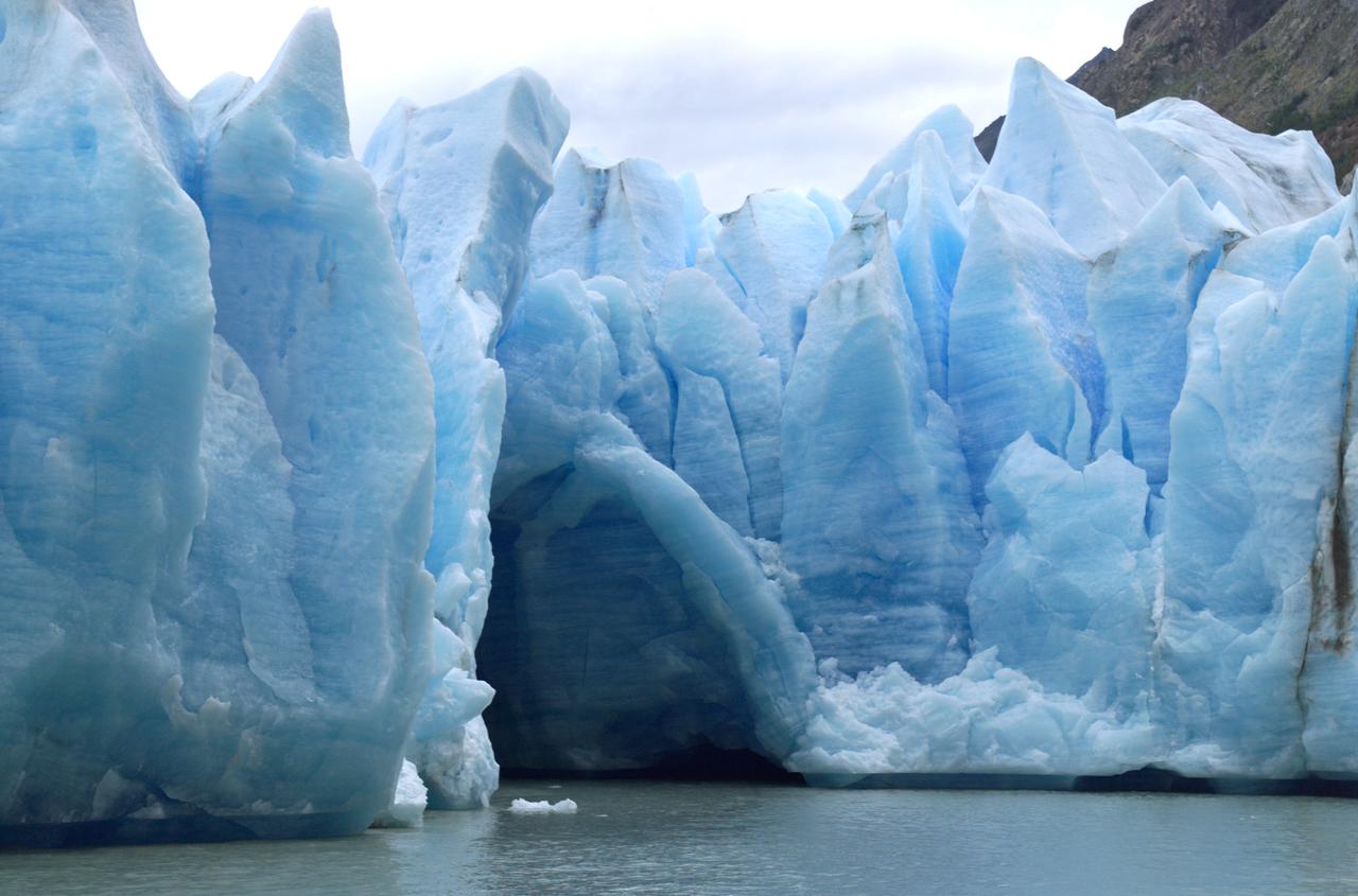 A cave in Glacier Grey in Torres del Paine National Park, seen during NASA's AirSAR 2004 campaign in Chile. AirSAR 2004 is a three-week expedition in Central and South America by an international team of scientists that is using an all-weather imaging tool, called the Airborne Synthetic Aperture Radar (AirSAR), located onboard NASA's DC-8 airborne laboratory. Scientists from many parts of the world are combining ground research with NASA's AirSAR technology to improve and expand on the quality of research they are able to conduct. Founded in 1959, Torres del Paine National Park encompasses 450,000 acres in the Patagonia region of Chile. This region is being studied by NASA using a DC-8 equipped with an Airborne Synthetic Aperture Radar (AirSAR) developed by scientists from NASA’s Jet Propulsion Laboratory. This is a very sensitive region that is important to scientists because the temperature has been consistently rising causing a subsequent melting of the region’s glaciers. AirSAR will provide a baseline model and unprecedented mapping of the region. This data will make it possible to determine whether the warming trend is slowing, continuing or accelerating. AirSAR will also provide reliable information on ice shelf thickness to measure the contribution of the glaciers to sea level.