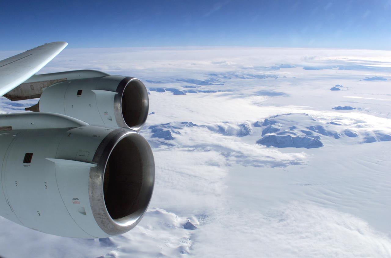 The Larsen Ice Shelf in Antarctica viewed from NASA's DC-8 aircraft during the AirSAR 2004 campaign. AirSAR 2004 is a three-week expedition in Central and South America by an international team of scientists that is using an all-weather imaging tool, called the Airborne Synthetic Aperture Radar (AirSAR), located onboard NASA's DC-8 airborne laboratory. Scientists from many parts of the world are combining ground research with NASA's AirSAR technology to improve and expand on the quality of research they are able to conduct. These photos are from the DC-8 aircraft while flying an AirSAR mission over Antarctica. The Antarctic Peninsula is more similar to Alaska and Patagonia than to the rest of the Antarctic continent. It is drained by fast glaciers, receives abundant precipitation, and melts significantly in the summer months. In recent decades, the Peninsula has experienced significant atmospheric warming (about 2 degrees C since 1950), which has triggered a vast and spectacular retreat of its floating ice shelves, glacier reduction, a decrease in permanent snow cover and a lengthening of the melt season. As a result, the contribution to sea level from this region could be rapid and substantial. With an area of 120,000 km, or ten times the Patagonia ice fields, the Peninsula could contribute as much as 0.4mm/yr sea level rise, which would be the largest single contribution to sea level from anywhere in the world.  This region is being studied by NASA using a DC-8 equipped with the Airborne Synthetic Aperture Radar developed by scientists from NASA’s Jet Propulsion Laboratory. AirSAR will provide a baseline model and unprecedented mapping of the region. This data will make it possible to determine whether the warming trend is slowing, continuing or accelerating. AirSAR will also provide reliable information on ice shelf thickness to measure the contribution of the glaciers to sea level.