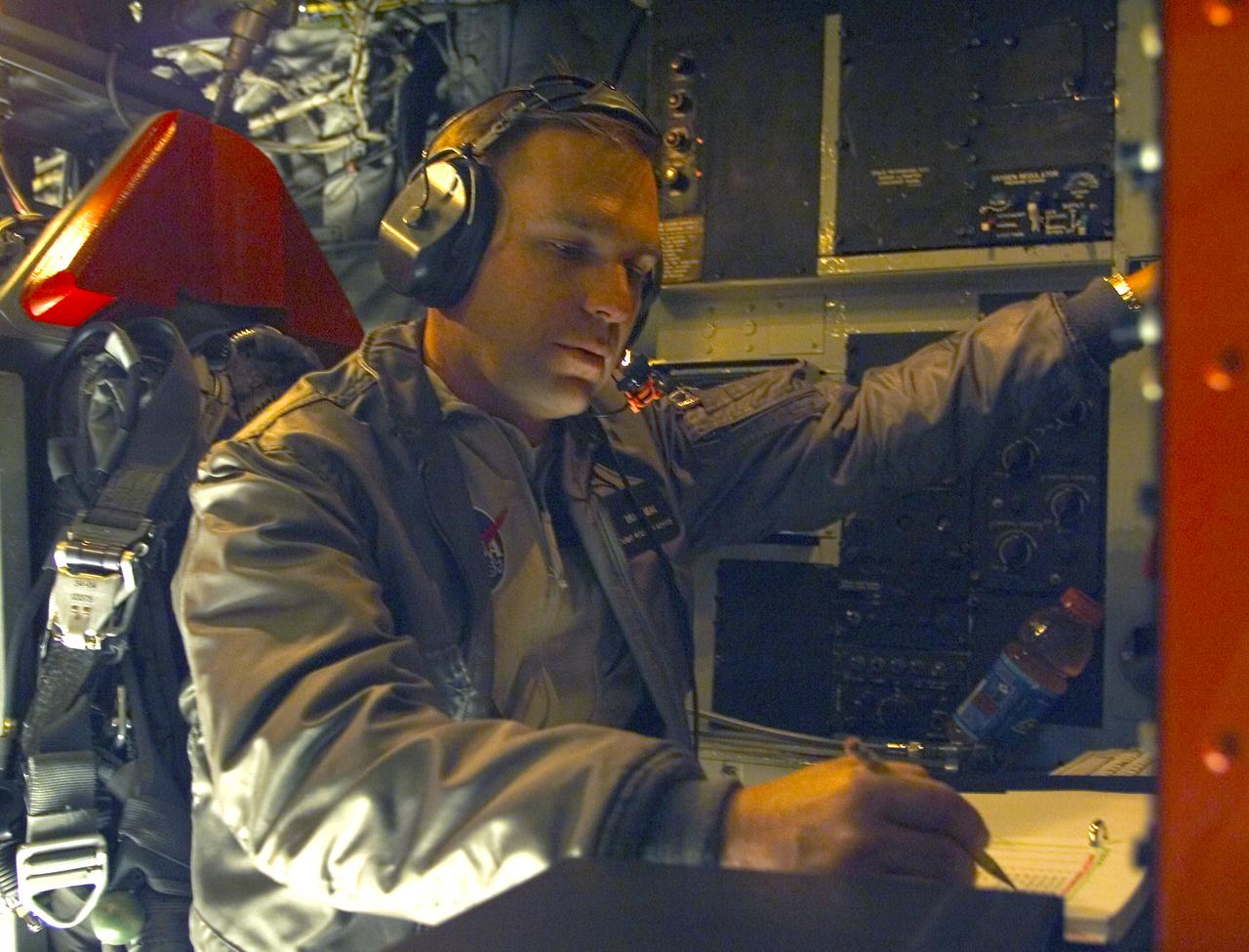 NASA X-43A Monitor Station Operator Brad Neal performs final checks and pre-flight preparations aboard the B-52 for the third X-43A research vehicle Mach 10 flight on November 16, 2004. Takeoff of the B-52B mothership carrying the X-43A took place at 1 p.m., PST, with launch of the booster rocket/X-43A approximately an hour later.