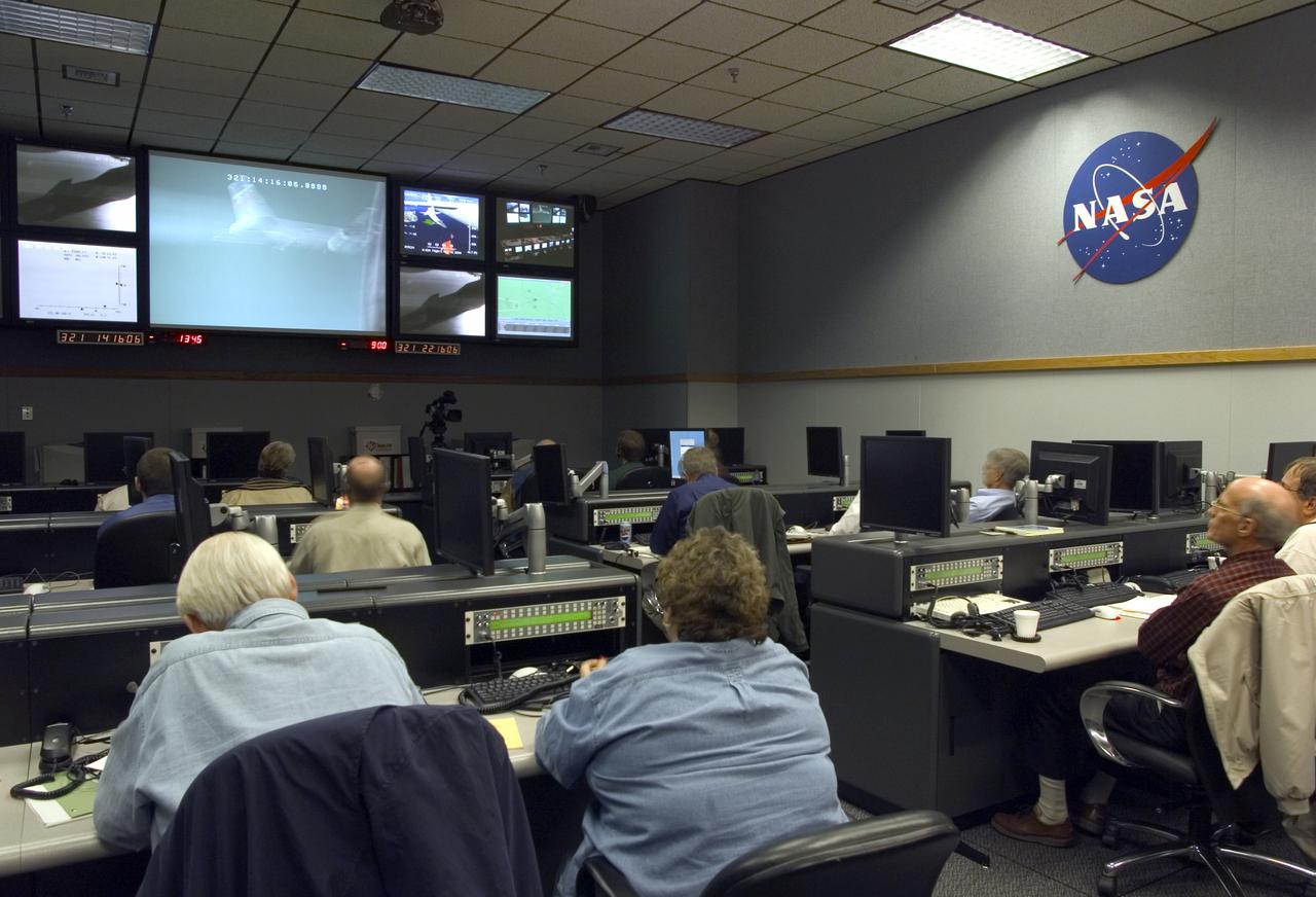 NASA engineers monitor mission progress from a Dryden control room prior to launch of the X-43A scramjet and its booster from NASA's B-52B mothership.