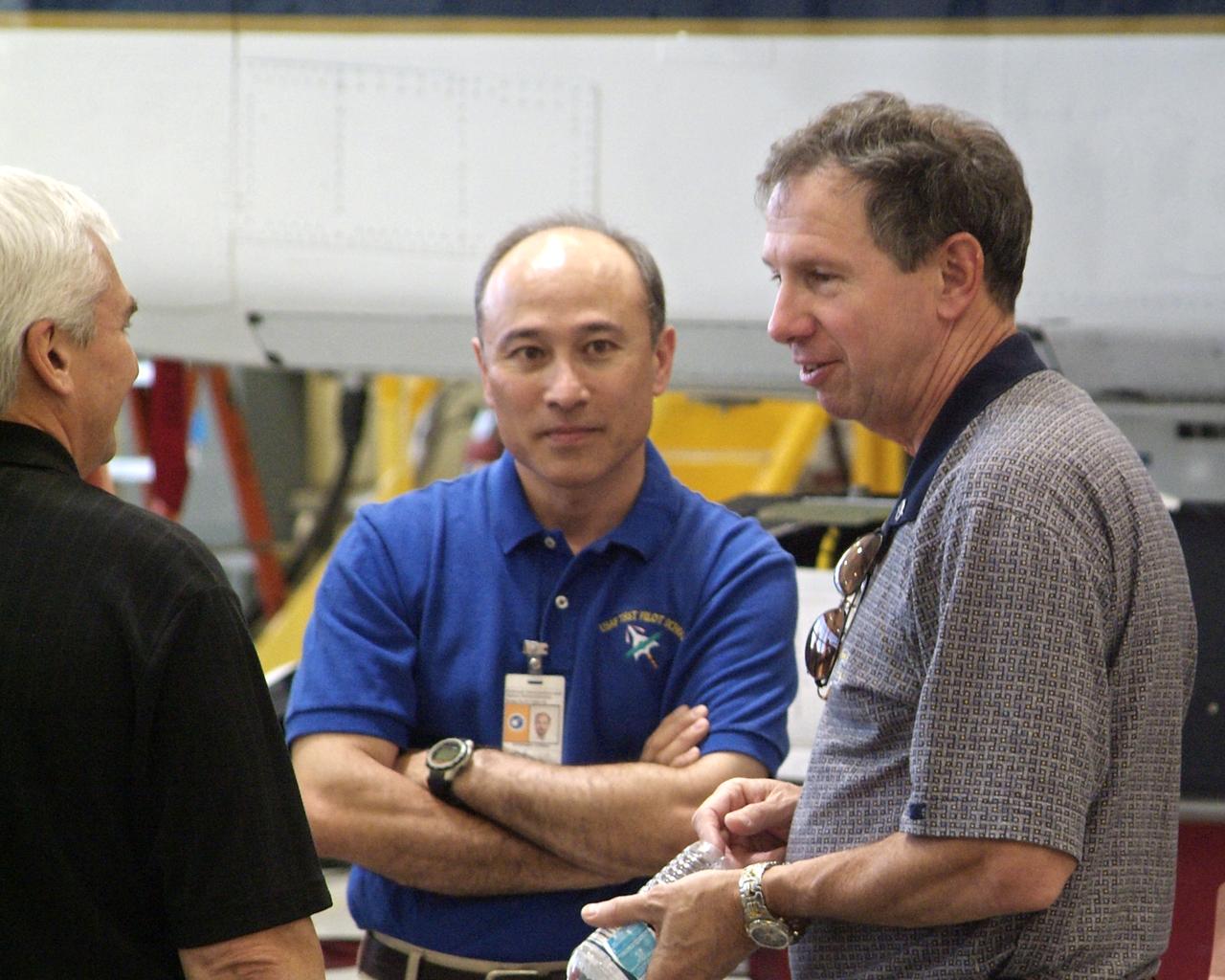 New NASA Administrator Michael Griffin (right) shares a moment with Director Kevin Petersen (left) and F-15B project manager Stephen Corda (center) during Griffin's visit to NASA Dryden Flight Research Center on Tuesday, May 24.